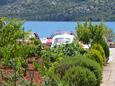 Poljica, Trogir, Parking lot 10237 - Apartments near sea with pebble beach.