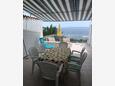 Seget Vranjica, Terrace in the apartment, with a sea view and WiFi.