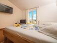 Rogoznica, Bedroom 1 in the apartment, air condition available, (pet friendly) and WiFi.