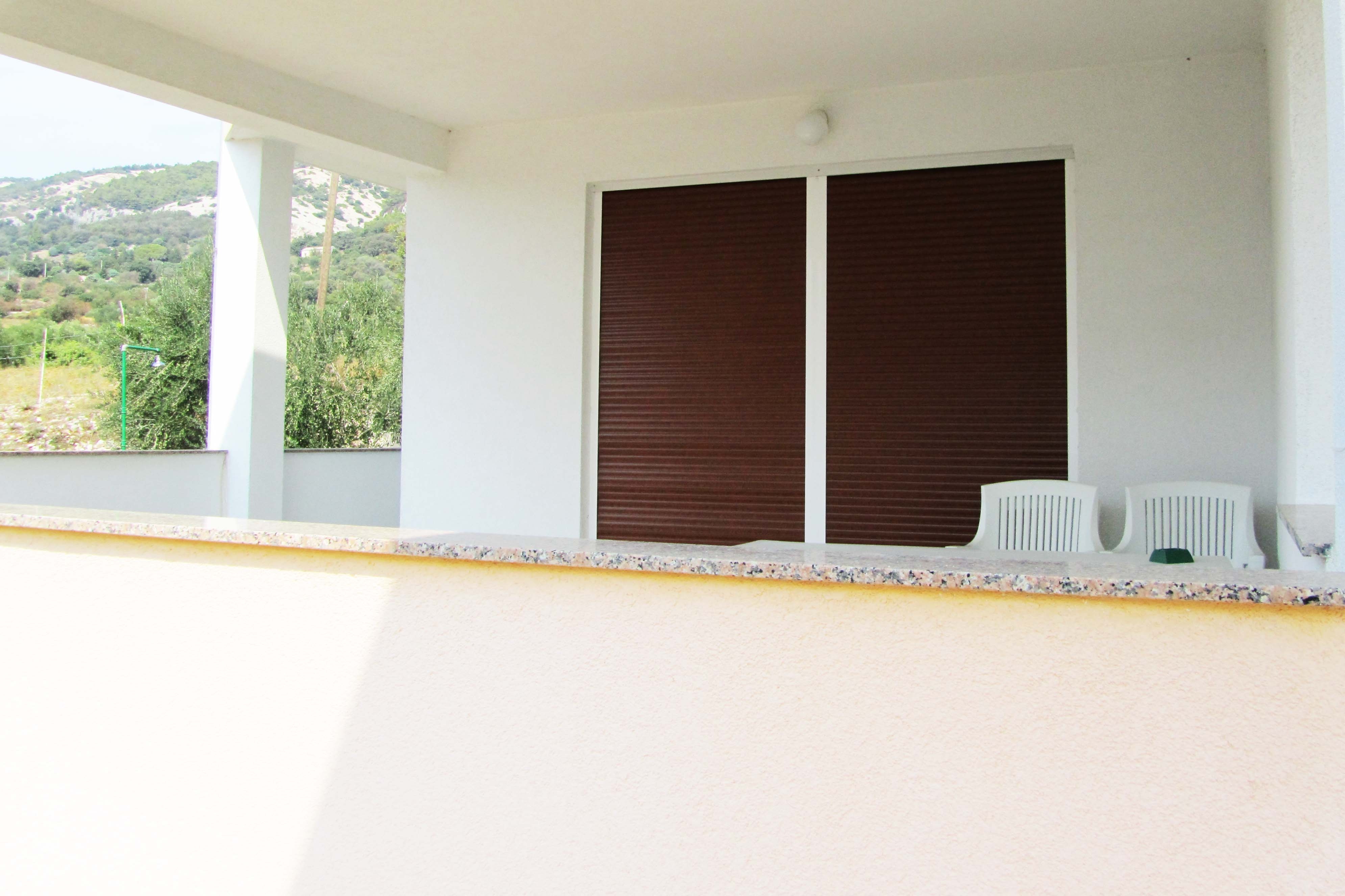 One bedroom apartment with terrace and sea view Banjol, Rab  A-a