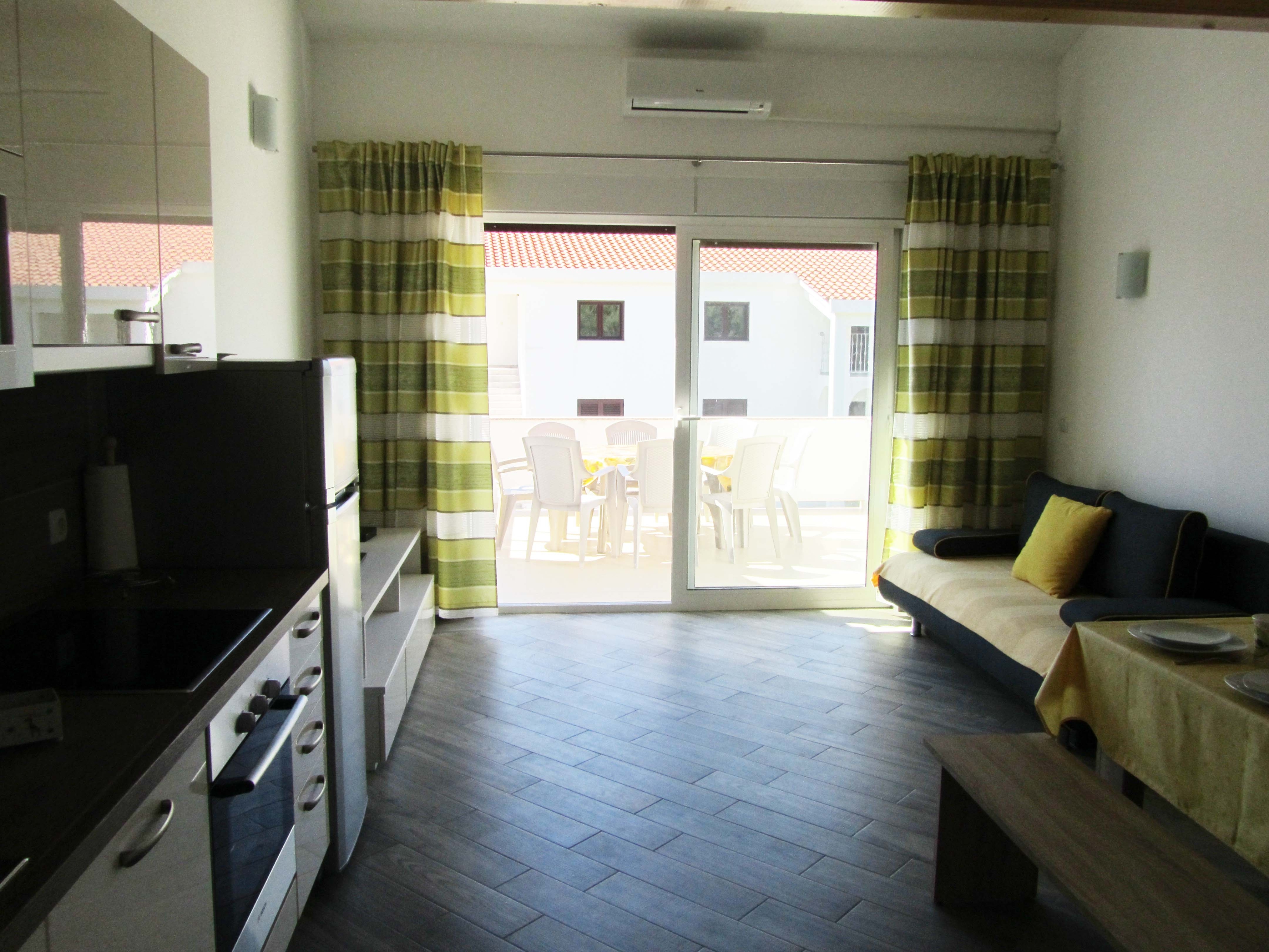 Two bedroom apartment with terrace and sea view Banjol, Rab (A-11082-b)