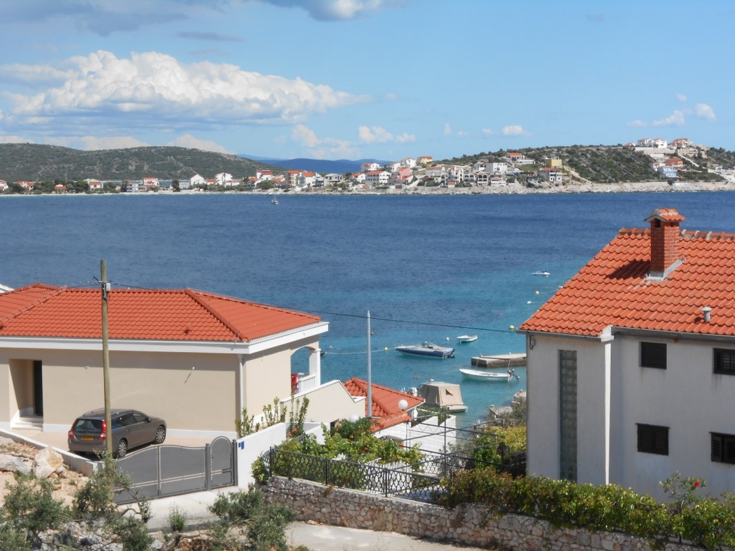 Two bedroom apartment with terrace and sea view Cove Oštrička luka, Rogoznica  A-d