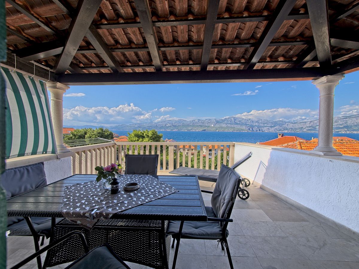 Two bedroom apartment with terrace and sea view Postira, Brač (A-11582-a)