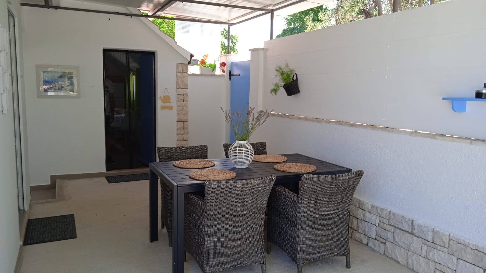 Two bedroom house with terrace and sea view Postira, Brač  K