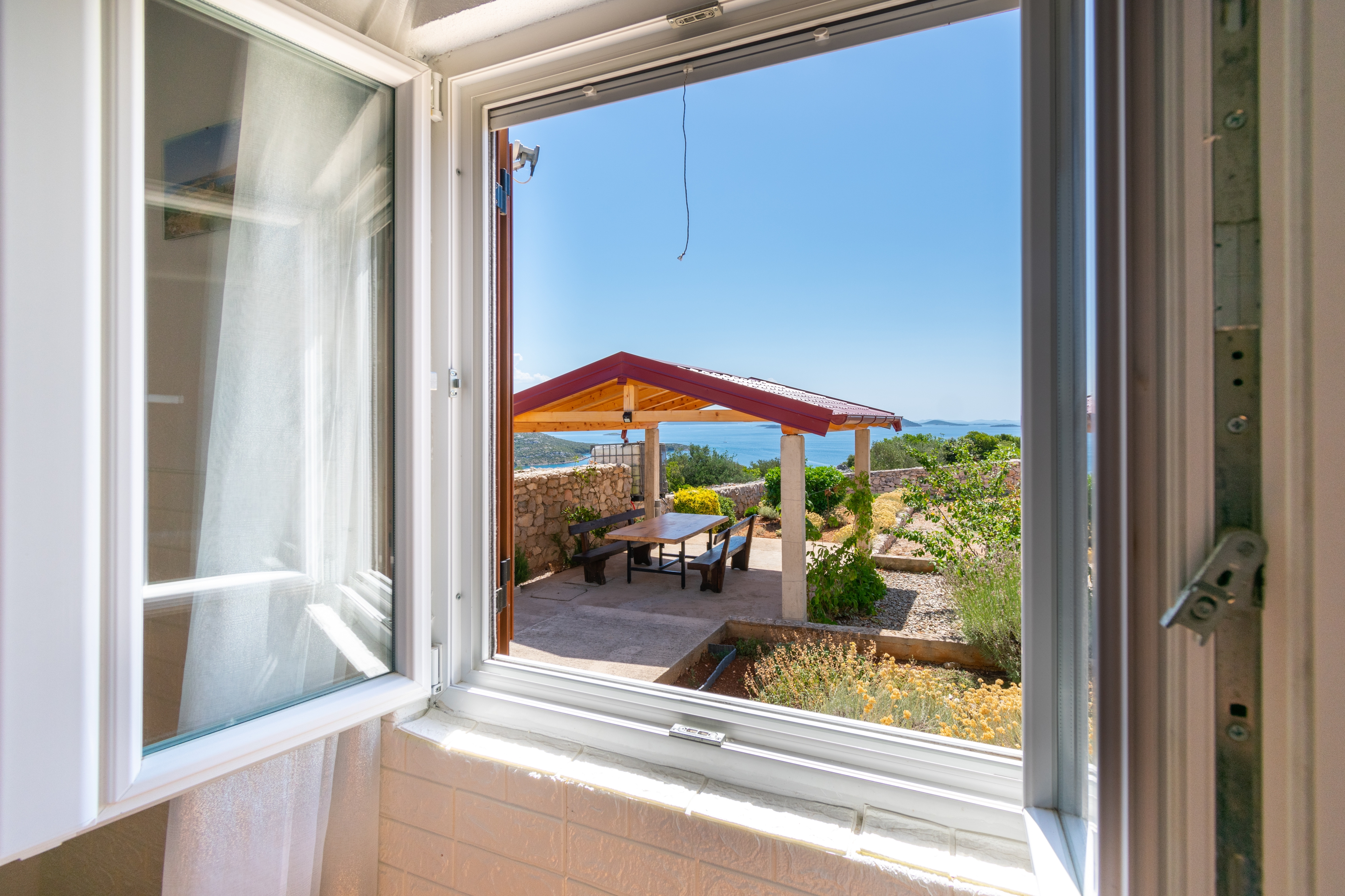 Two bedroom house with terrace and sea view Cove Triluke, Pašman  K