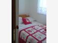 Spavaća soba 1 Živogošće - Porat, Spavaća soba 1 u smještaju tipa apartment, dostupna klima i WiFi.