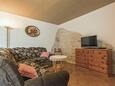 Living room 1 Gajana, Living room 1 in the house, air condition available, (pet friendly) and WiFi.