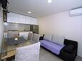 Obývací pokoj Kaštel Sućurac, Obývací pokoj v ubytování typu apartment, s klimatizací a WiFi.