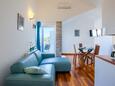 Living room Murter, Living room in the apartment, air condition available, (pet friendly) and WiFi.