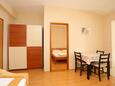 Nemira, Dining room in the apartment, air condition available and WiFi.