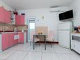 Blagovaonica Lopar, Blagovaonica u smještaju tipa apartment, dostupna klima i WiFi.