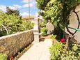 Baška, Krk, Courtyard 18861 - Apartments with pebble beach.