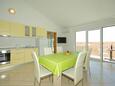 Dining room Krvavica, Dining room in the apartment, air condition available and WiFi.