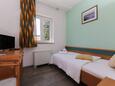 Ložnice Supetar, Ložnice v ubytování typu room, s klimatizací, domácí mazlíčci povoleni a WiFi.