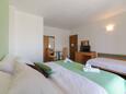 Ložnice Supetar, Ložnice v ubytování typu room, s klimatizací, domácí mazlíčci povoleni a WiFi.