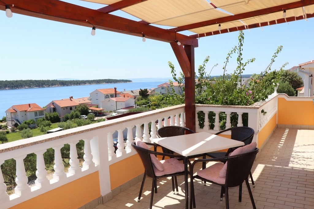 Two bedroom apartment with terrace and sea view Barbat, Rab (A-20080-a)