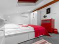 Punat, Спальня 1 в размещении типа apartment, доступный кондиционер и WiFi.