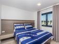 Спальня 1 Vantačići, Спальня 1 в размещении типа apartment, доступный кондиционер.