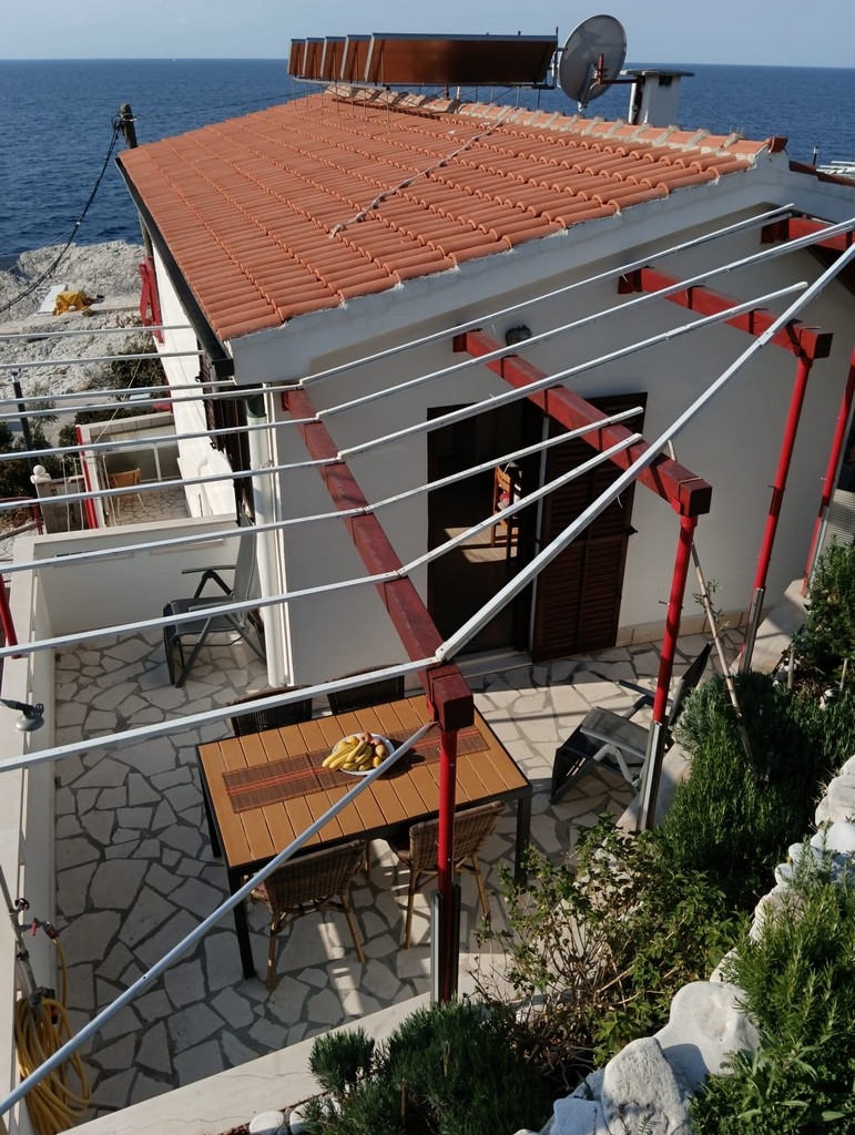 Two bedroom apartment with terrace and sea view Cove Zaraće (Dubovica), Hvar  A-a