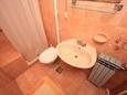 Ванная комната Pješčana Uvala, Ванная комната в размещении типа apartment.