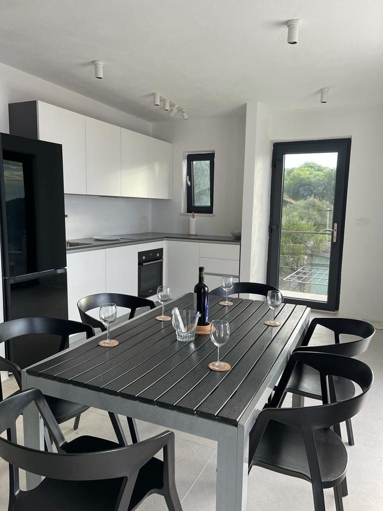 Two bedroom apartment with terrace and sea view Postira, Brač  A-b