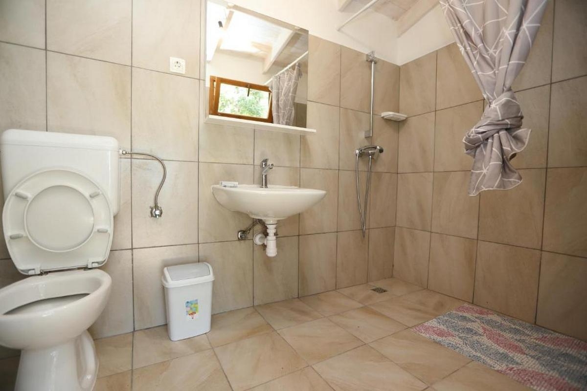 Two bedroom house with terrace and sea view Cove Mikavica, Žirje  K