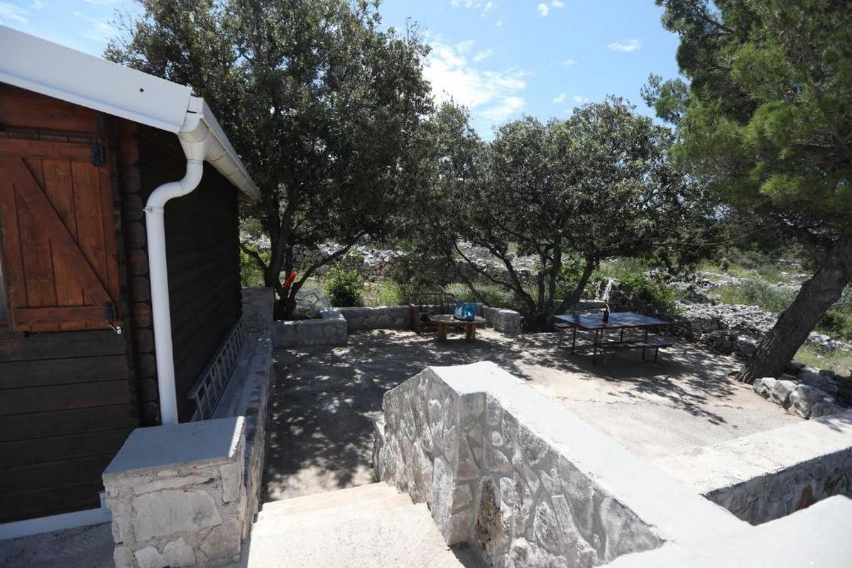 Two bedroom house with terrace and sea view Cove Mikavica, Žirje  K