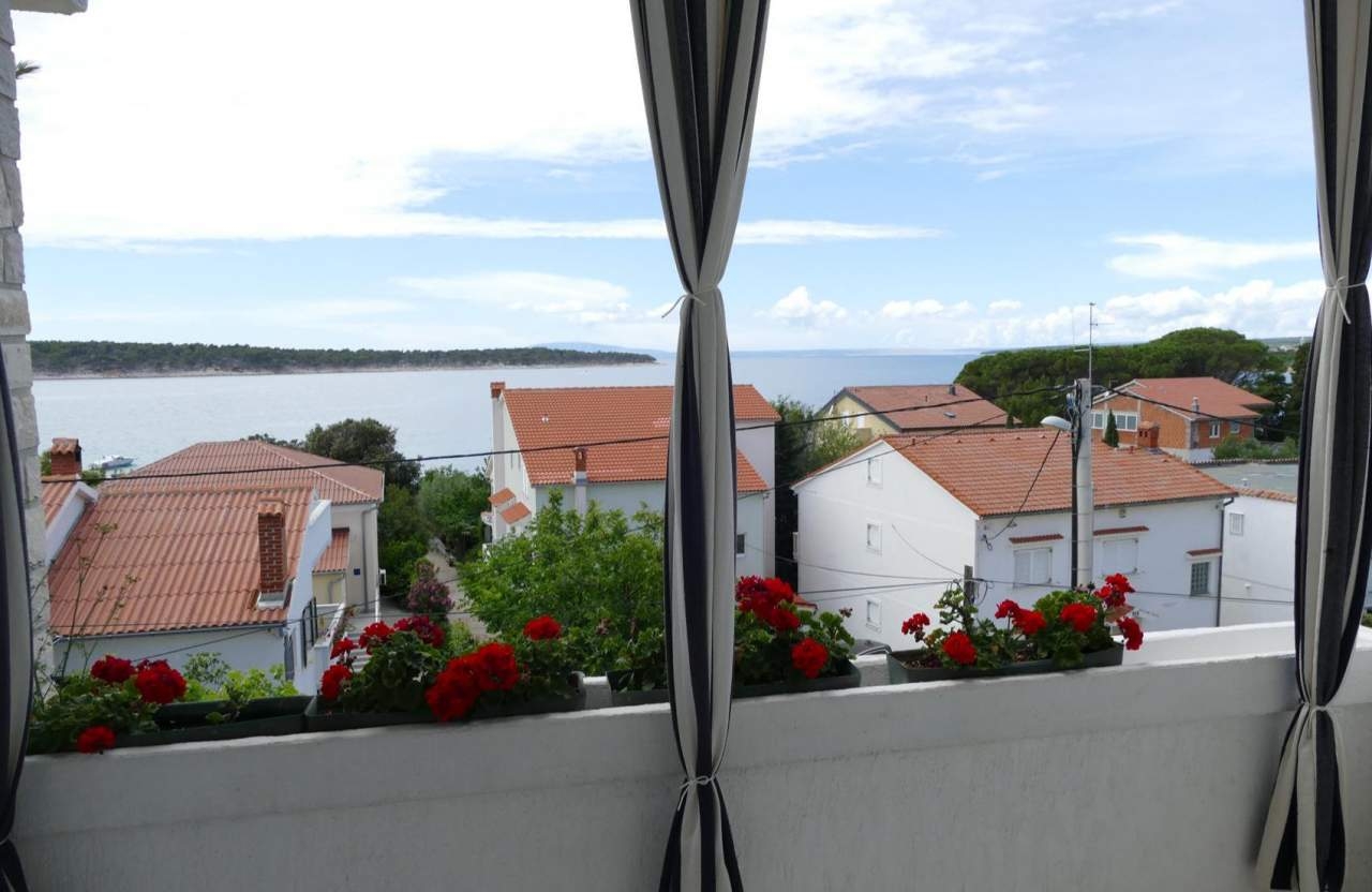 Two bedroom apartment with terrace and sea view Barbat, Rab (A-22564-a)