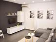 Novi Vinodolski, Living room in the apartment, air condition available and WiFi.