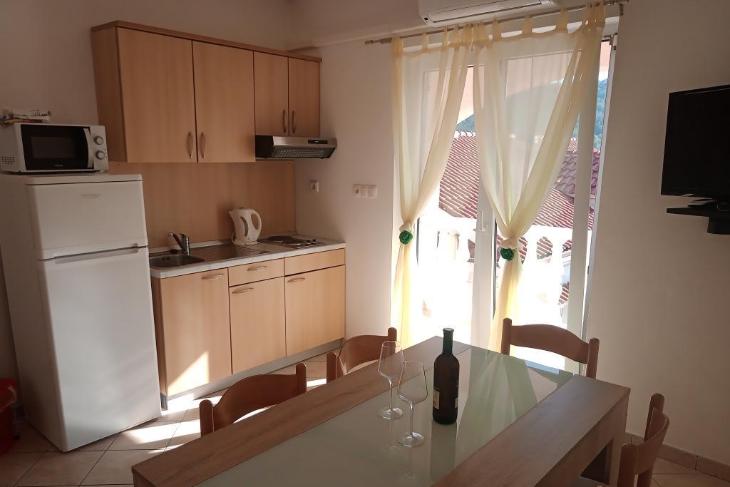 Two bedroom apartment with balcony Lopar, Rab (A-23825-b)