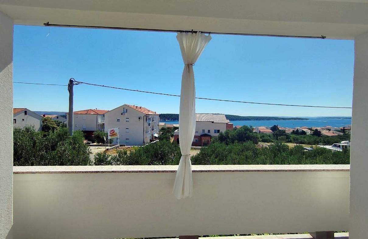 Two bedroom apartment with terrace and sea view Barbat, Rab (A-25045-a)