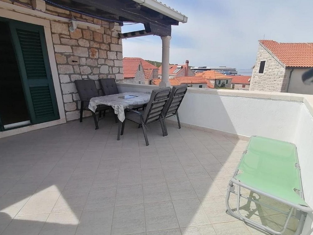 Two bedroom apartment with terrace and sea view Postira, Brač (A-25147-a)