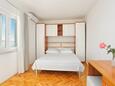 Спальня 1 Podgora, Спальня 1 в размещении типа apartment, доступный кондиционер и WiFi.
