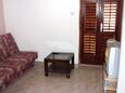 Living room Postira, Living room in the apartment, air condition available, (pet friendly) and WiFi.
