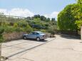 Parking lot Postira, Brač, Parking lot 3065 - Apartments with pebble beach.