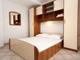 Ložnice Pag, Ložnice v ubytování typu studio-apartment, s klimatizací, domácí mazlíčci povoleni a WiFi.