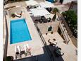 Courtyard Tisno, Murter, Courtyard 3219 - Rooms near sea with pebble beach.