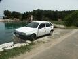 Parking lot Kali, Ugljan, Parking lot 346 - Apartments near sea with pebble beach.
