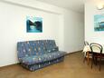 Molunat, Living room in the apartment, air condition available, (pet friendly) and WiFi.