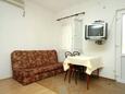 Dining room Molunat, Dining room in the studio-apartment, air condition available, (pet friendly) and WiFi.