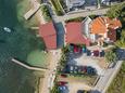 Parkiralište Stara Novalja, Pag, Parkiralište 4071 - Apartmani blizu mora sa šljunčanom plažom.