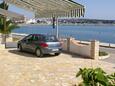 Novalja, Pag, Parking lot 4074 - Apartments near sea with rocky beach.