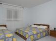Bedroom Kustići, Bedroom in the apartment, air condition available, (pet friendly) and WiFi.