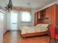 Caska, Bedroom in the studio-apartment, air condition available and WiFi.