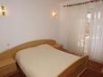 Lumbarda, Bedroom 1 in the apartment, air condition available.