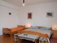 Ložnice Korčula, Ložnice v ubytování typu room, s klimatizací, domácí mazlíčci povoleni a WiFi.