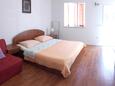 Mokalo, Bedroom in the studio-apartment, air condition available and WiFi.