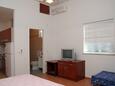 Mokalo, Bedroom in the studio-apartment, air condition available and WiFi.