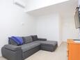 Obývací pokoj Duće, Obývací pokoj v ubytování typu apartment, s klimatizací a WiFi.