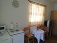 Saplunara, Dining room in the studio-apartment, air condition available and WiFi.